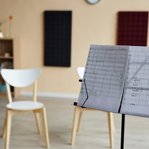 notebook-with-sheet-music-in-music-class-QD6RG6X